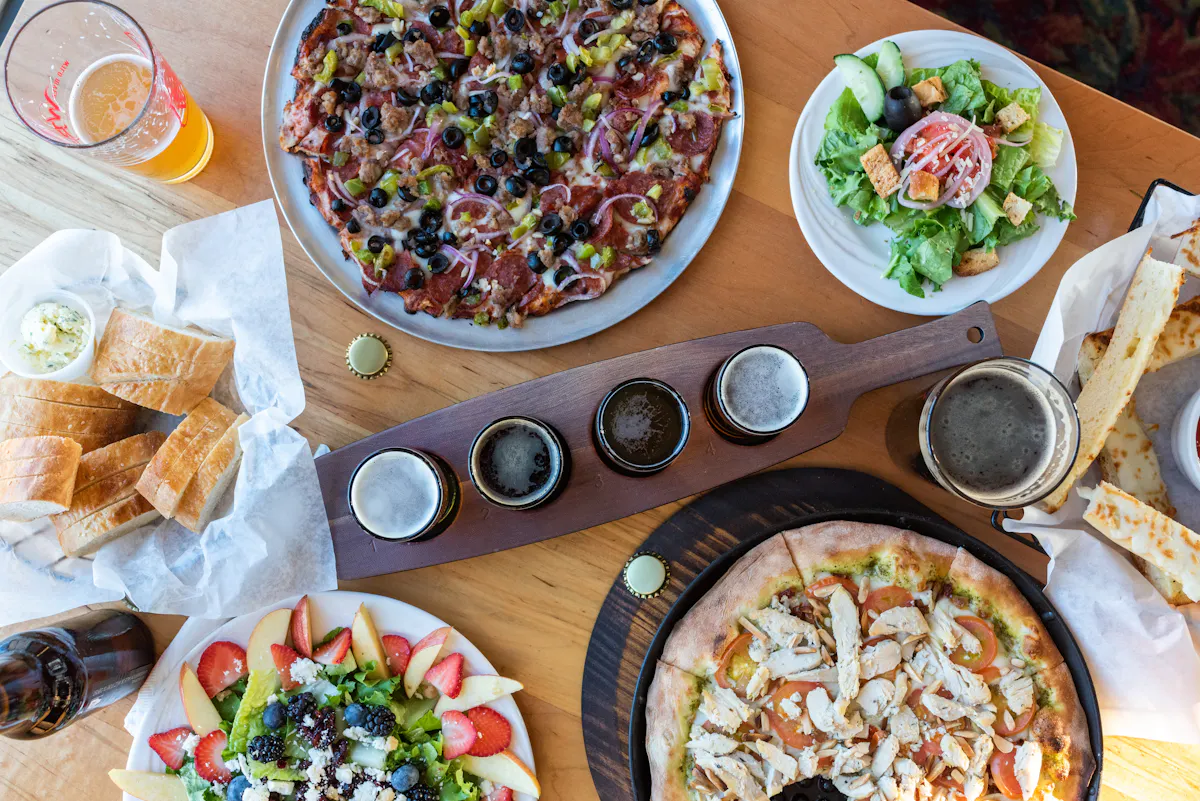 a bunch of food sitting on top of a wooden table